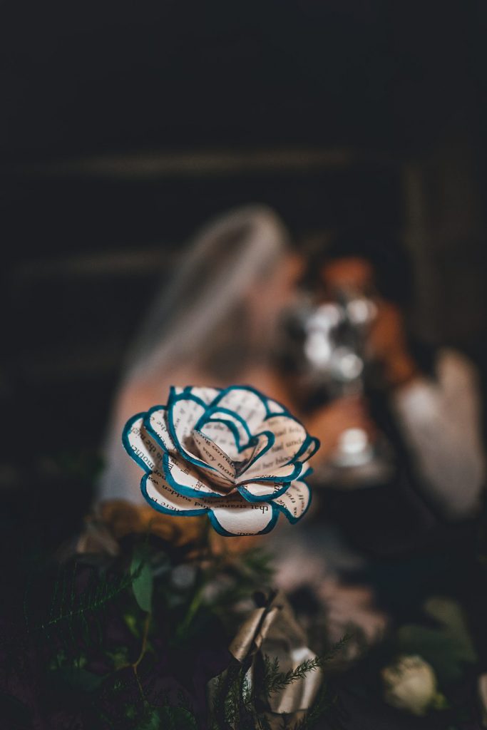 A blue rose and wedding rings from our Ravenclaw styled shoot