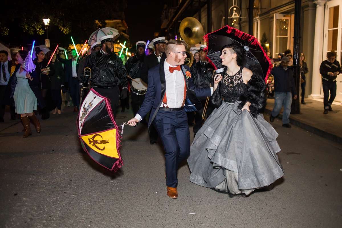 A brass band leads a lightsaber-lit second line parade at a Star Wars wedding