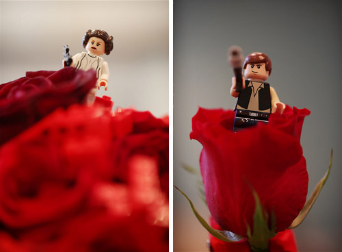 LEGO Princess Leia and Han Solo minifigures perched in red rose centerpieces