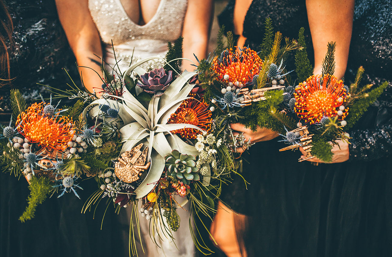 Star Wars bouquets with Millennium Falcon and X-wing charms tucked into air plants